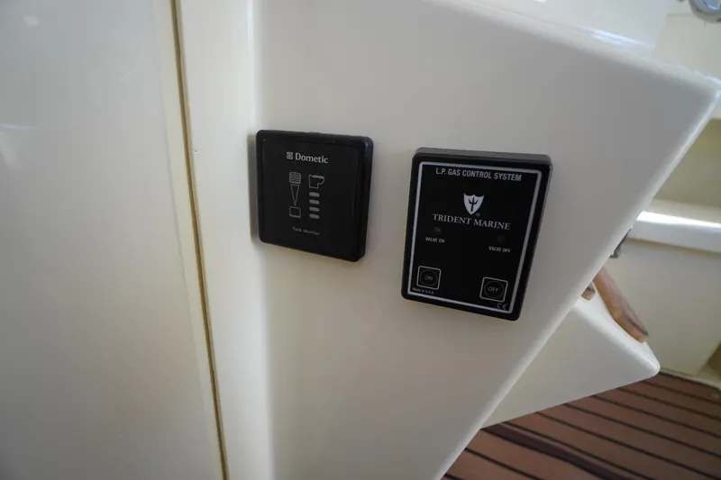 Slide: The Image of Control panels on 2016 Rosborough 246 Dingby boat, featuring Dometic and Trident Marine systems. - 12