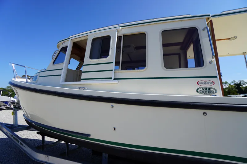 Slide: The Image of 2016 Rosborough 246 Dingby boat on trailer under clear blue sky. - 3