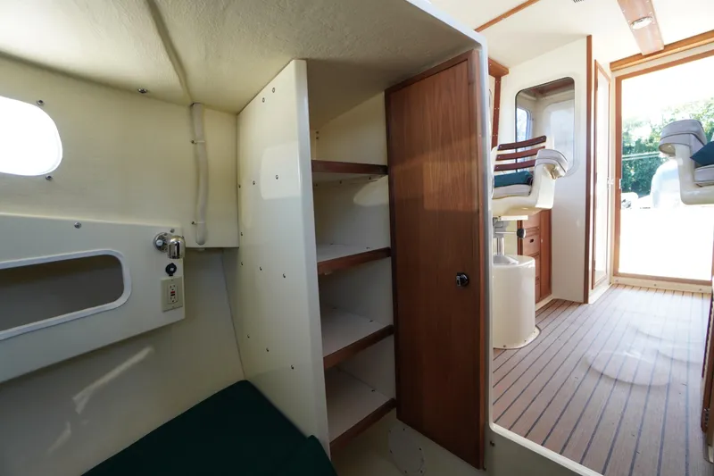 Slide: The Image of Interior of 2016 Rosborough 246 Dingby boat with seating and storage shelves. - 30