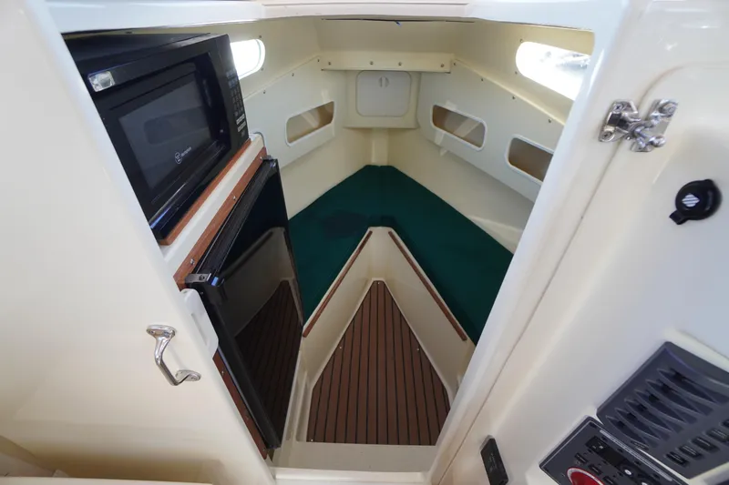 Slide: The Image of 2016 Rosborough 246 Dingby cabin interior with microwave and compact kitchenette. - 33