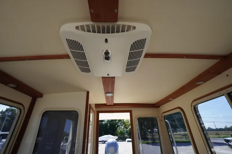 Slide: The Image of Interior view of 2016 Rosborough 246 Dingby boat, featuring ceiling air vent and wooden trim. - 35