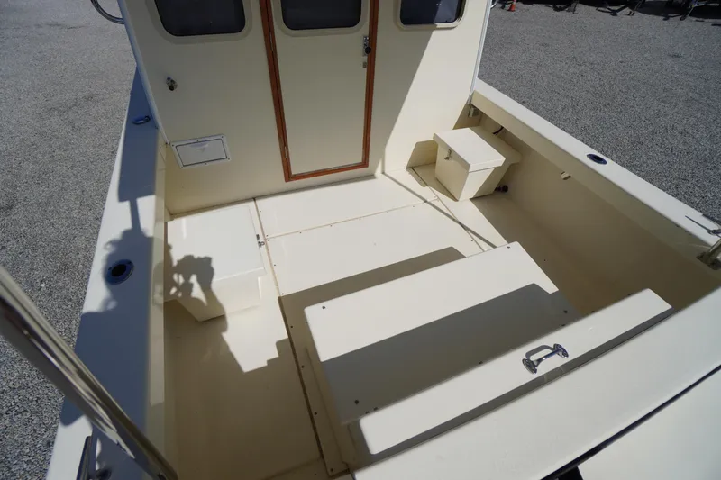 Slide: The Image of 2016 Rosborough 246 Dingby boat interior with seating and storage compartments. - 42