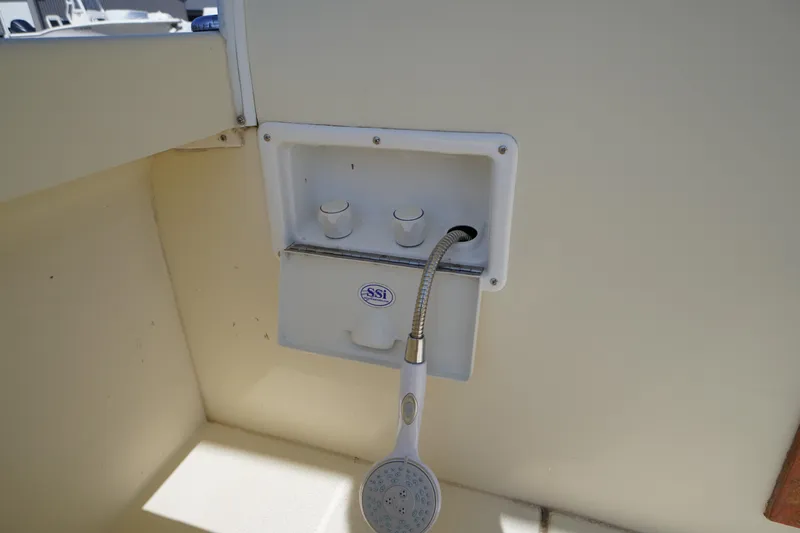 Slide: The Image of Outdoor shower fixture on 2016 Rosborough 246 Dingby boat, featuring dual knobs and handheld showerhead. - 47