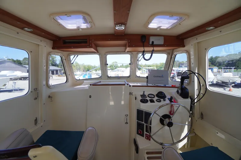 Slide: The Image of Interior of 2016 Rosborough 246 Dingby boat with steering wheel and navigation equipment. - 5