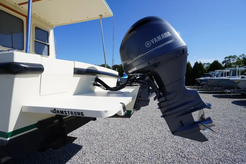 Slide: The Image of 2016 Rosborough 246 Dingby boat with Yamaha outboard motor on gravel lot. - 50
