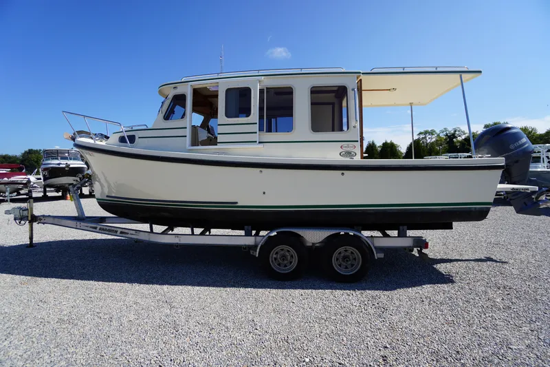 Slide: The Image of 2016 Rosborough 246 Dingby boat on trailer under clear blue sky. - 55