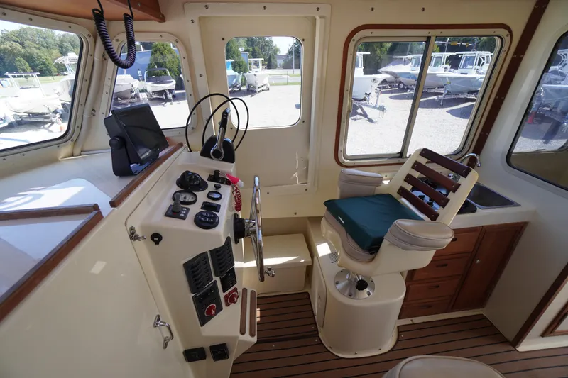 Slide: The Image of Interior of 2016 Rosborough 246 Dingby boat with helm, controls, and captain's chair. - 6