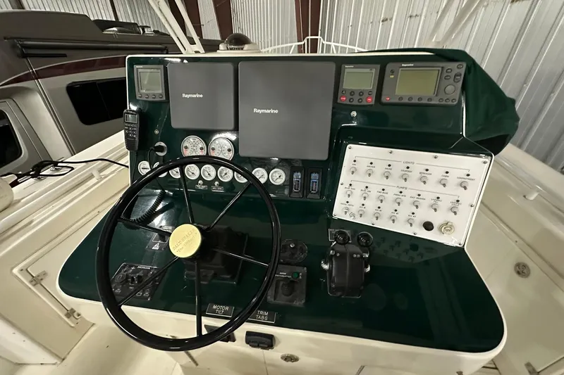 Slide: The Image of Control panel of a 2004 Salt Shaker 30 boat with navigation instruments. - 14