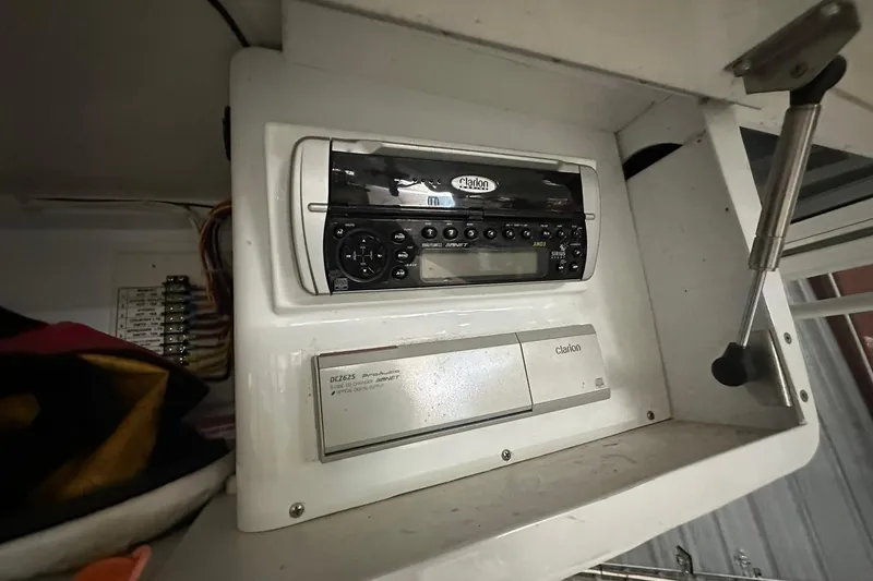 Slide: The Image of Clarion audio system in a Salt Shaker 30, 2004 model, installed in a white cabinet. - 19