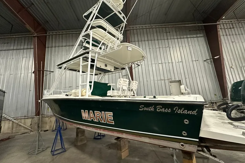 Slide: The Image of Interior of a 2004 Salt Shaker 30 boat cabin with storage and seating. - 3