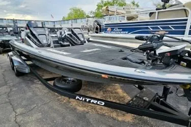Slide: The Image of 2021 Nitro Z21 Pro bass boat on trailer, parked outdoors. - 5