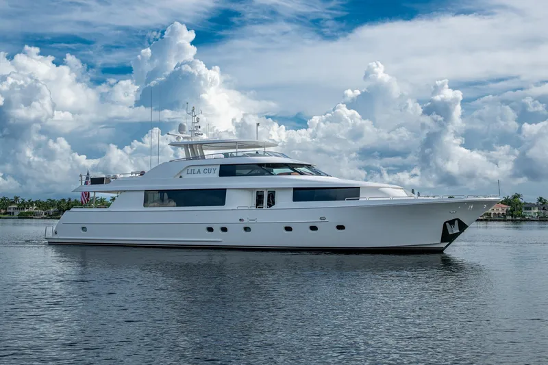 The Image of Luxury 2006 Westport 112 yacht on calm water under a cloudy sky. - 0