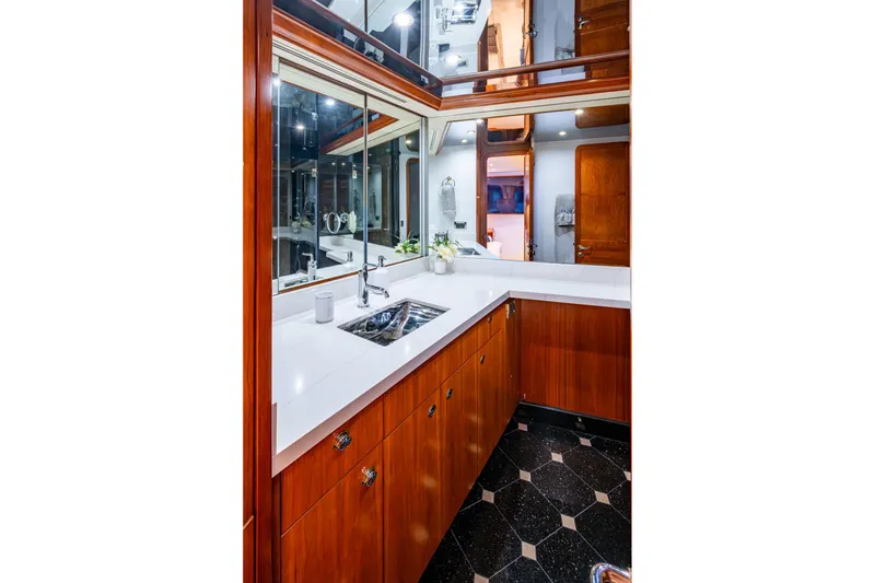 Slide: The Image of Luxurious bathroom interior on 2006 Westport 112 yacht with wood cabinetry and modern fixtures. - 38