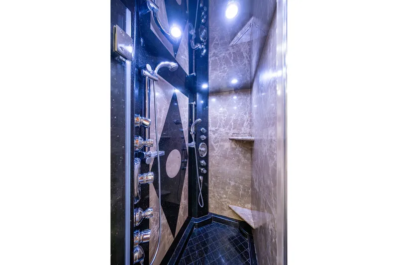 Slide: The Image of Luxurious marble shower interior with modern fixtures in a 2006 Westport 112 yacht. - 40