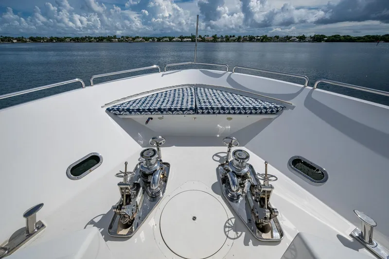 Slide: The Image of Bow view of 2006 Westport 112 yacht with winches and patterned sunpad. - 105
