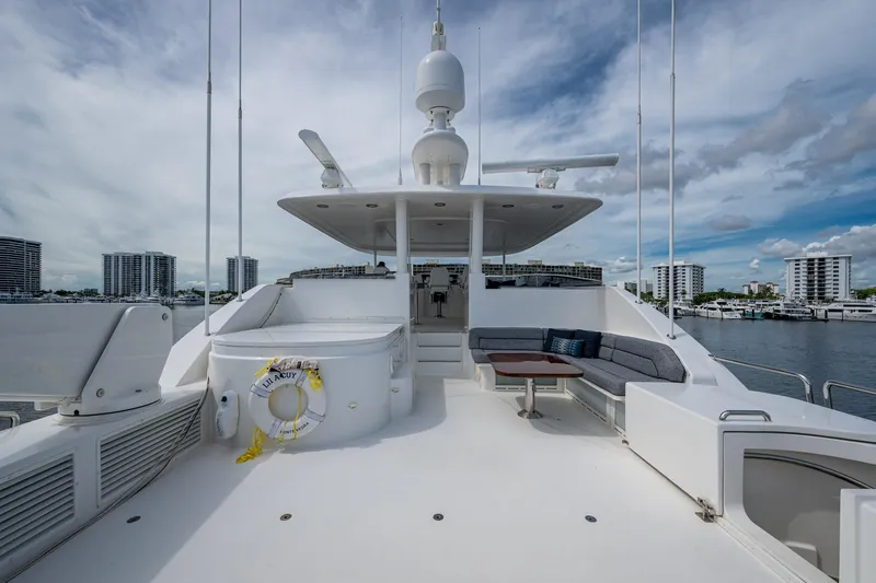 Slide: The Image of Luxurious 2006 Westport 112 yacht deck with seating area and cityscape view. - 78