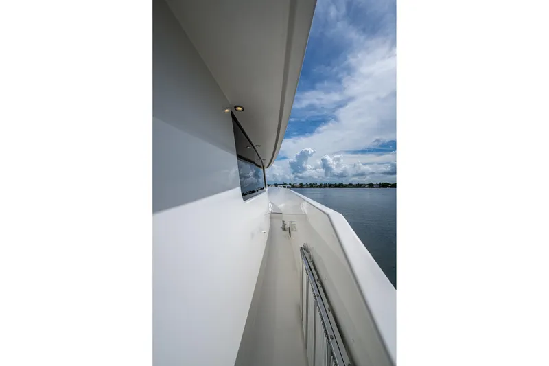 Slide: The Image of Side view of 2006 Westport 112 yacht with ocean and sky backdrop. - 100