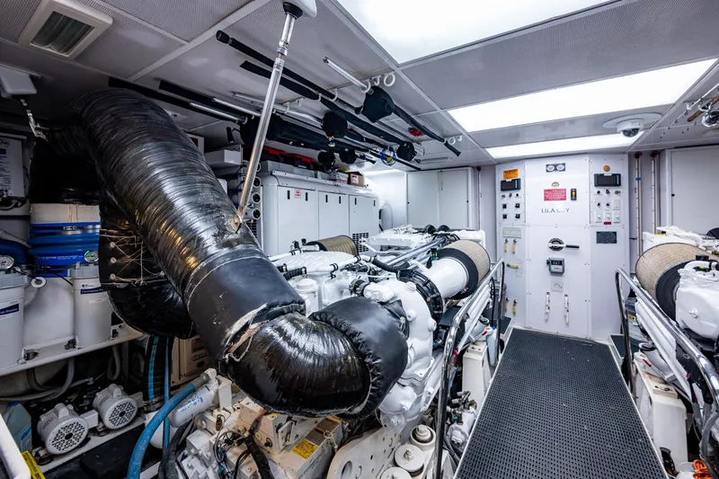 Slide: The Image of Engine room of a 2006 Westport 112 yacht, featuring advanced machinery and equipment. - 107