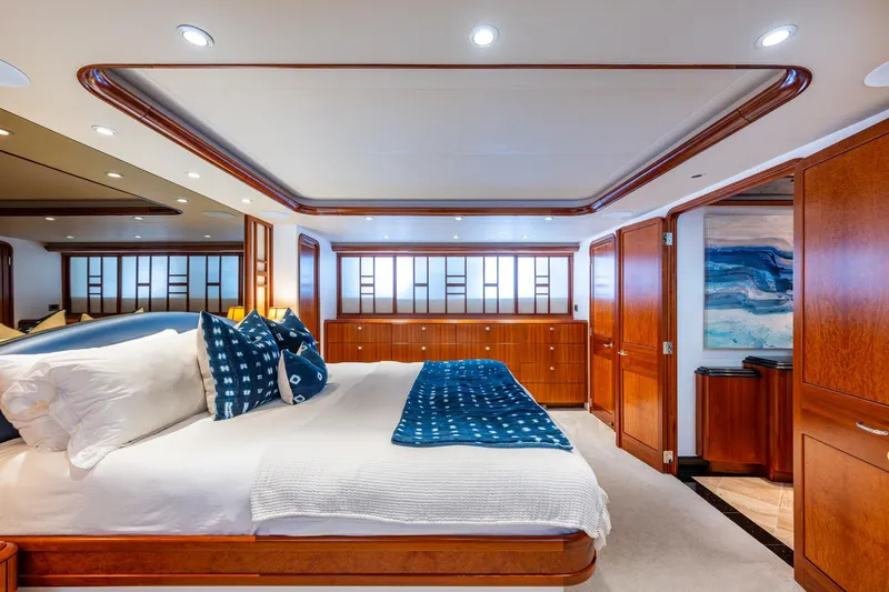 Slide: The Image of Luxurious 2006 Westport 112 yacht bedroom with elegant wood finishes and modern decor. - 37