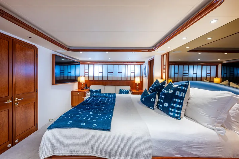 Slide: The Image of Luxurious 2006 Westport 112 yacht bedroom with elegant decor and modern amenities. - 32