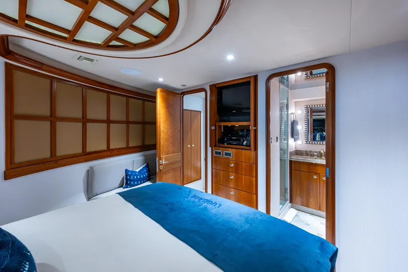Slide: The Image of Luxurious bedroom interior on 2006 Westport 112 yacht with wood accents and ensuite bathroom. - 62