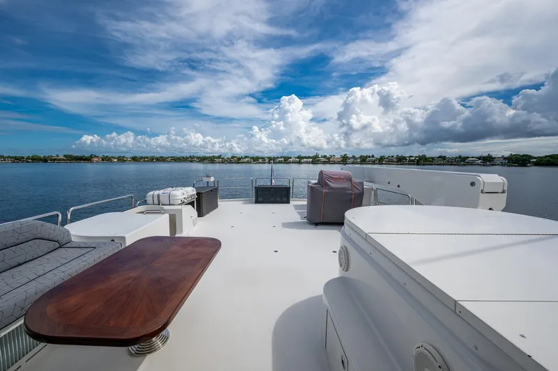 Slide: The Image of Luxurious 2006 Westport 112 yacht deck with scenic waterfront view. - 74