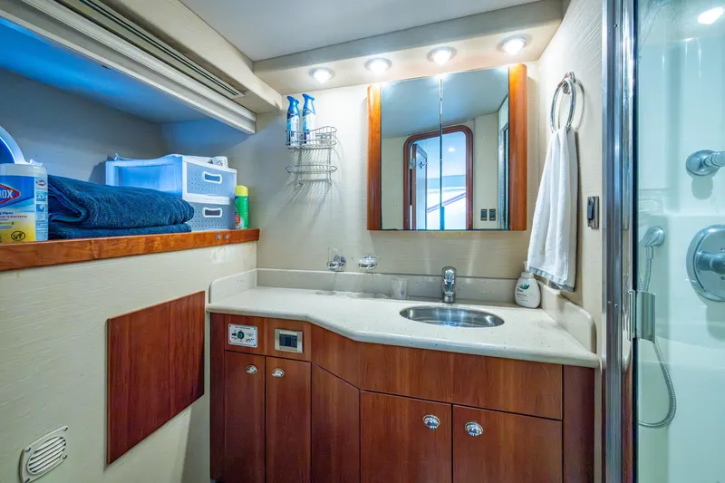 Slide: The Image of Luxurious bathroom in 2006 Westport 112 yacht with modern fixtures and ample storage. - 114