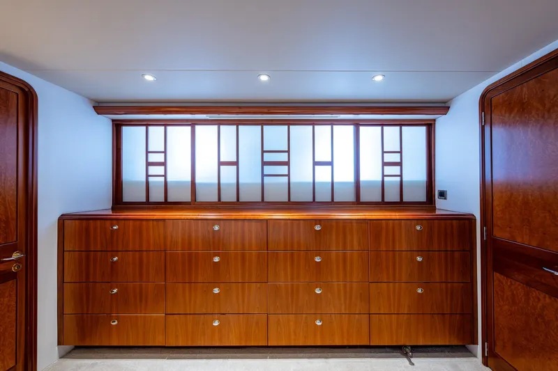 Slide: The Image of Luxurious wooden cabinetry on 2006 Westport 112 yacht interior, featuring elegant design and lighting. - 34