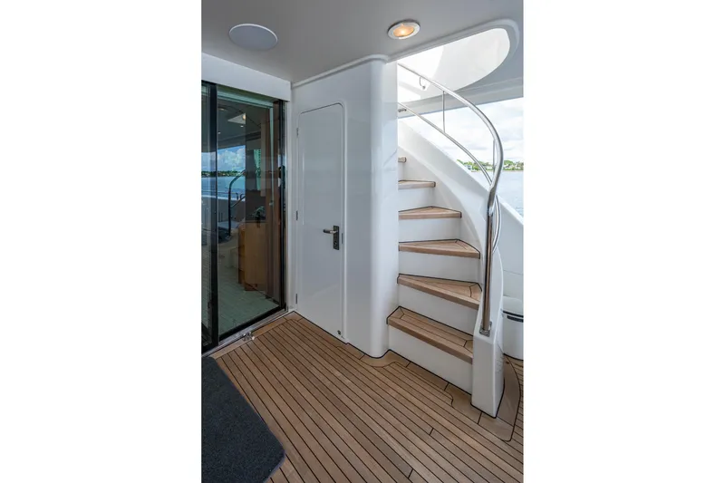 Slide: The Image of Staircase on 2006 Westport 112 yacht with teak flooring and sleek design. - 92