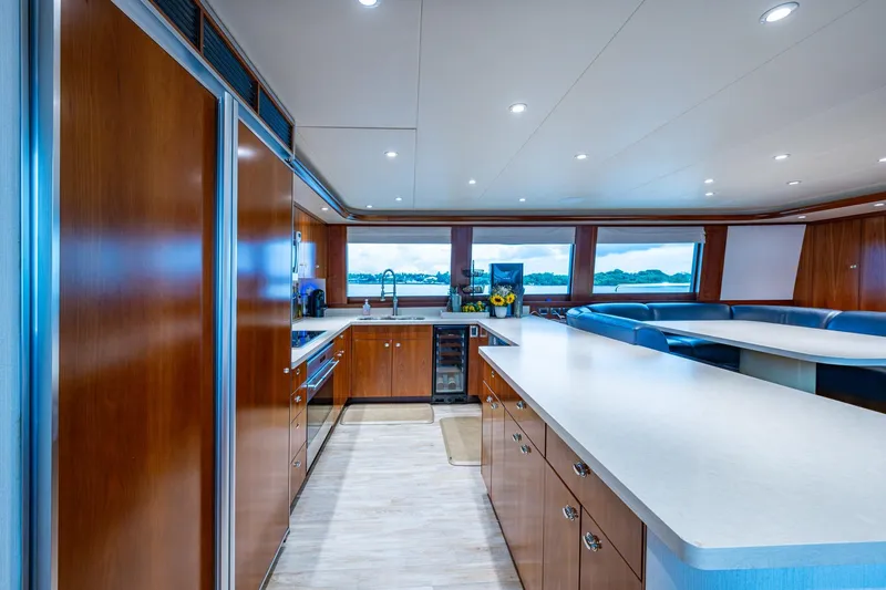Slide: The Image of Luxurious kitchen interior of 2006 Westport 112 yacht with modern amenities and panoramic windows. - 22