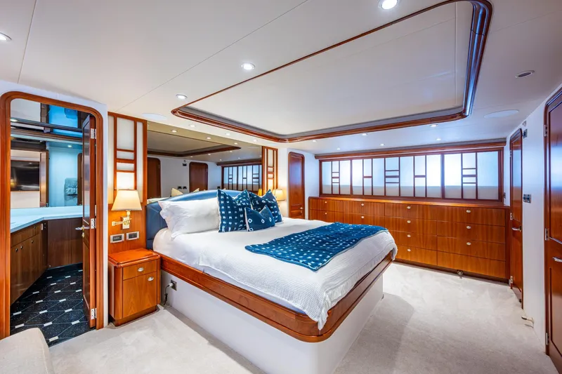Slide: The Image of Luxurious bedroom interior on 2006 Westport 112 yacht, featuring elegant wood finishes and modern design. - 30