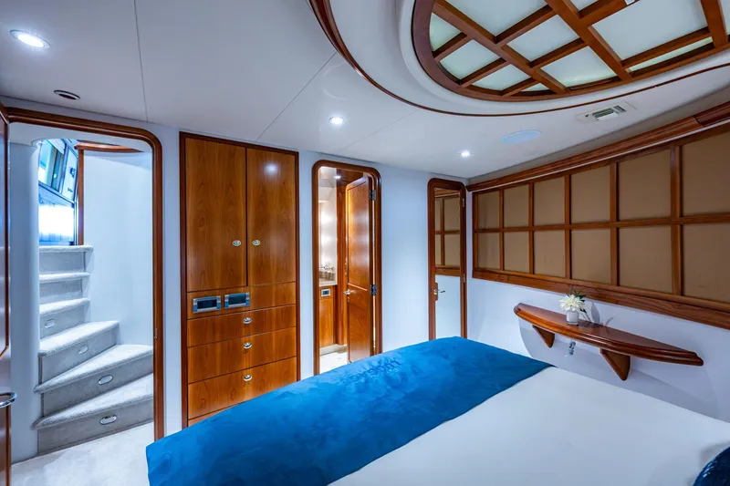 Slide: The Image of Luxurious 2006 Westport 112 yacht bedroom with elegant wood finishes and modern design. - 61