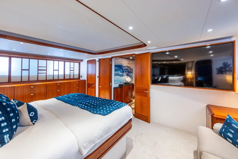Slide: The Image of Luxurious bedroom interior on 2006 Westport 112 yacht, featuring elegant wood finishes and modern amenities. - 36