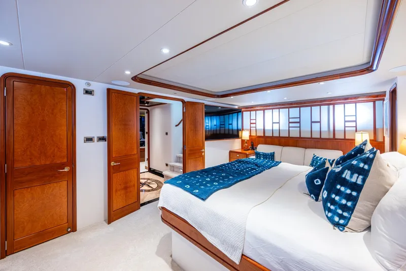 Slide: The Image of Luxurious bedroom interior on 2006 Westport 112 yacht, featuring elegant wood finishes and modern decor. - 35