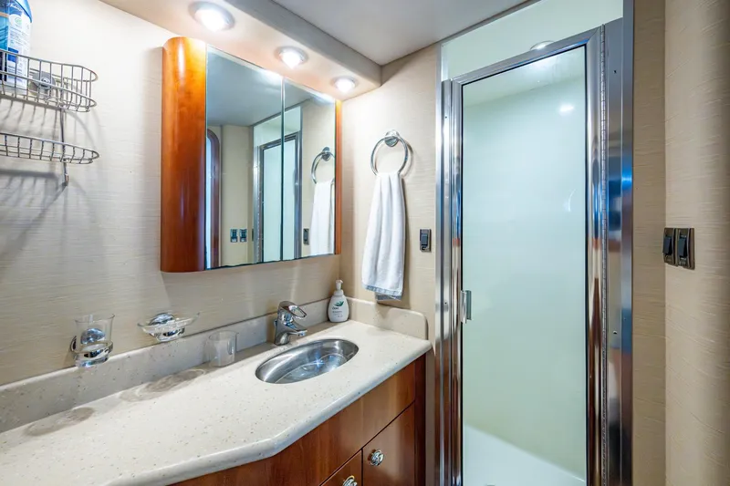 Slide: The Image of Luxurious bathroom in 2006 Westport 112 yacht with modern fixtures and elegant design. - 115