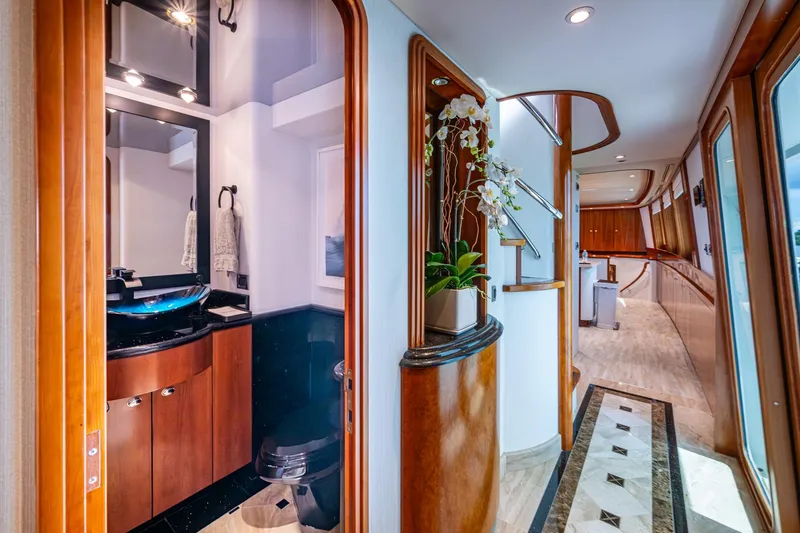 Slide: The Image of Luxurious interior of 2006 Westport 112 yacht featuring elegant bathroom and hallway design. - 20