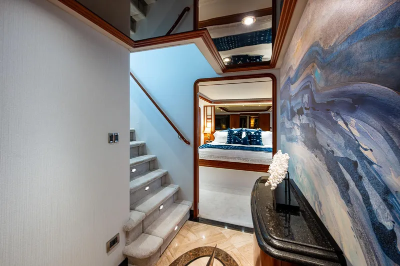 Slide: The Image of Luxurious interior of 2006 Westport 112 yacht with elegant staircase and bedroom view. - 28