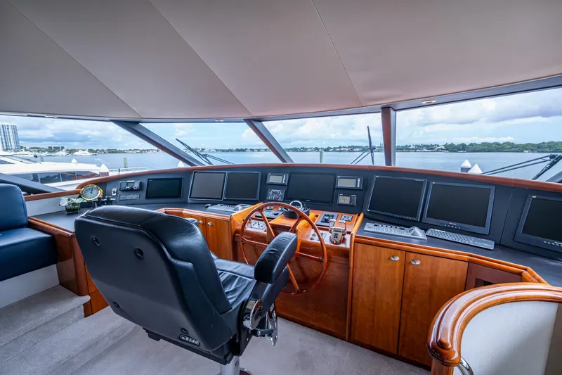 Slide: The Image of Luxurious 2006 Westport 112 yacht helm with panoramic views and advanced navigation systems. - 69