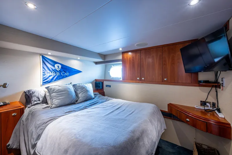 Slide: The Image of Luxurious bedroom interior on 2006 Westport 112 yacht with cozy bed and modern amenities. - 112