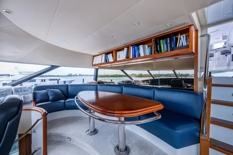 Slide: The Image of Luxurious interior of 2006 Westport 112 yacht with elegant seating and wooden table. - 72