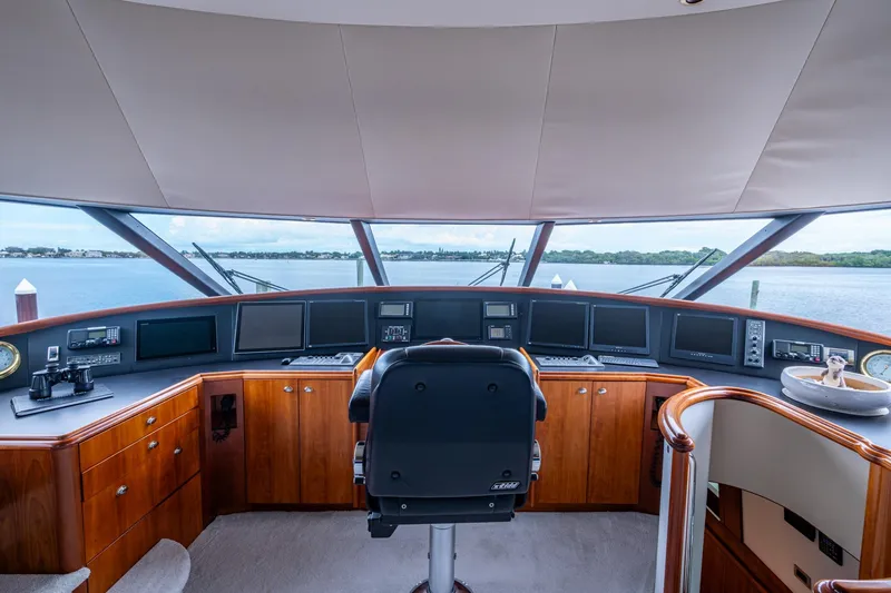 Slide: The Image of Helm of 2006 Westport 112 yacht with panoramic view and modern navigation equipment. - 67