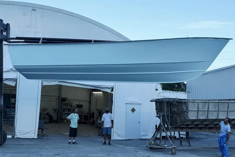 Slide: The Image of 2026 Albury Brothers 27 boat cruising on water near coastal homes. - 3