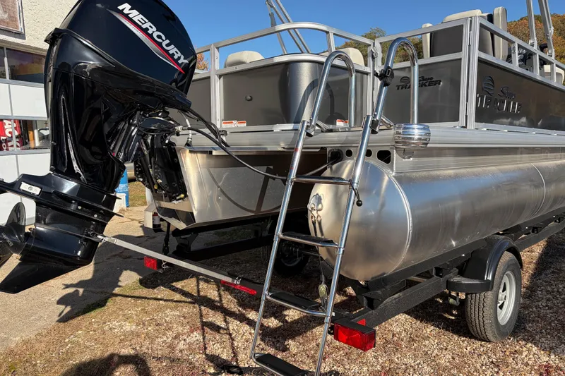 Slide: The Image of 2026 Sun Tracker Bass Buggy 18 DLX pontoon boat with Mercury outboard motor and ladder. - 13