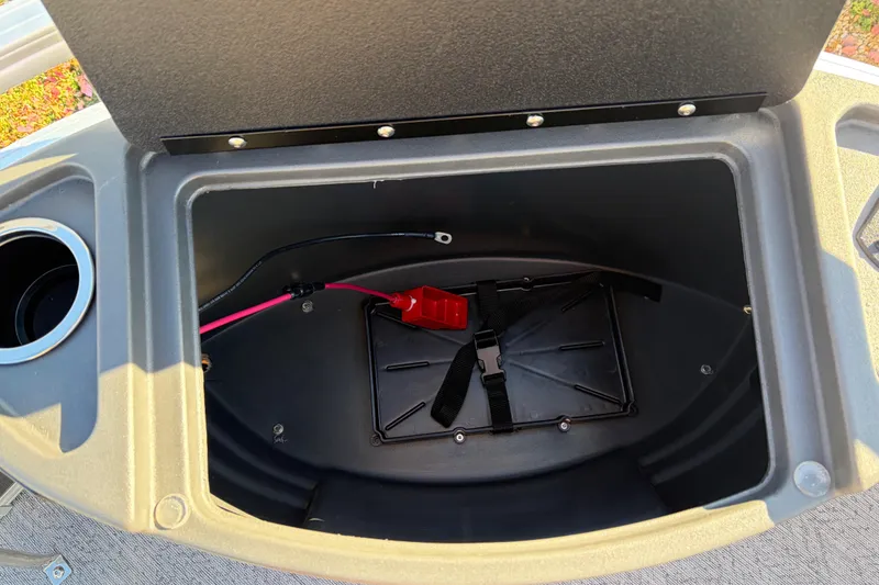 Slide: The Image of Open storage compartment in 2026 Sun Tracker Bass Buggy 18 DLX boat. - 18