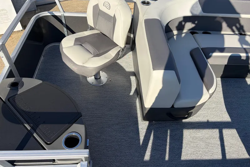 Slide: The Image of 2026 Sun Tracker Bass Buggy 18 DLX interior with seating and fishing station. - 22