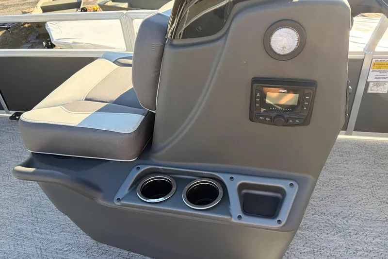 Slide: The Image of 2026 Sun Tracker Bass Buggy 18 DLX console with seating, cup holders, and audio controls. - 24