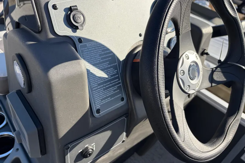 Slide: The Image of Steering wheel and dashboard of 2026 Sun Tracker Bass Buggy 18 DLX boat. - 25