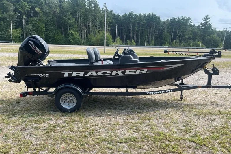 Slide: The Image of 2026 Tracker Super Guide V-16 SC boat on trailer, parked outdoors. - 3