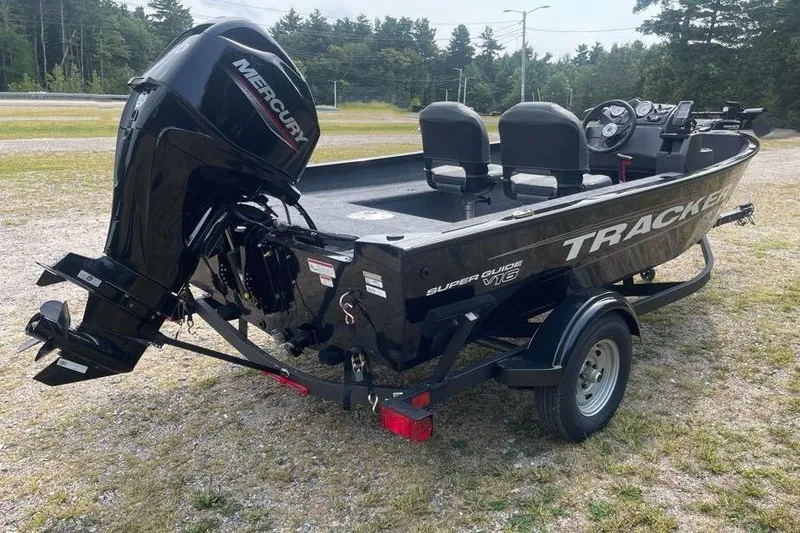 Slide: The Image of 2026 Tracker Super Guide V-16 SC boat with Mercury engine on trailer. - 5