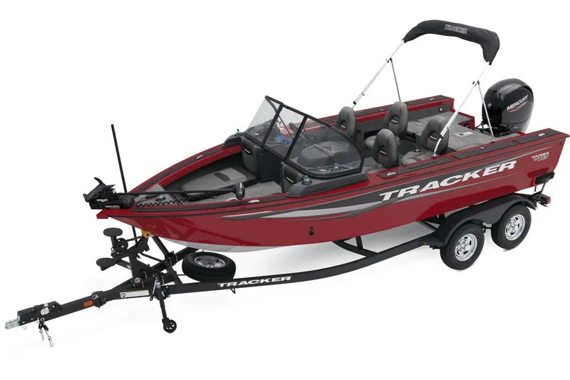 Slide: The Image of 2025 Tracker Targa V-18 Combo boat with powerful outboard motor, parked outdoors. - 8